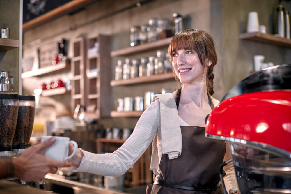 Barista serving a customer