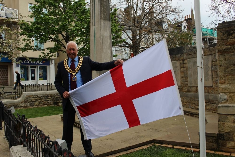 Cllr David Skipp raising the St George's flag in the Carfax