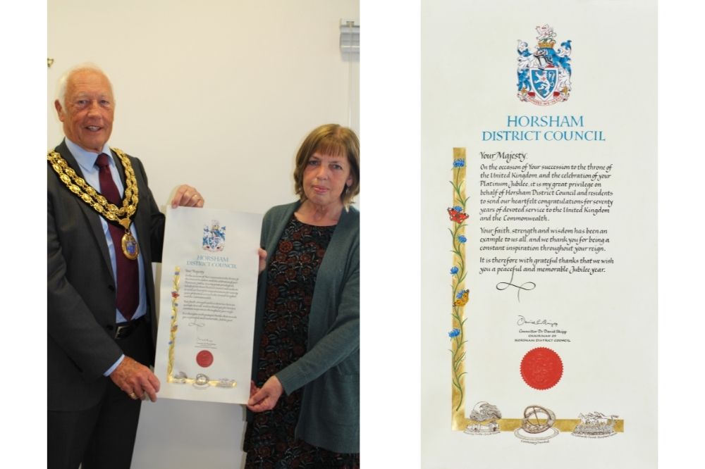 HDC Chairman Cllr David Skipp with the Jubilee commemorative scroll and creator Cathy Stables 