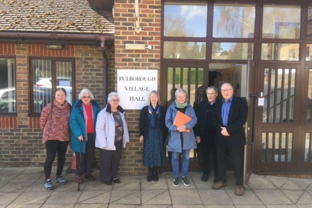 The trustees of Pulborough Social Centre gather outside the village hall