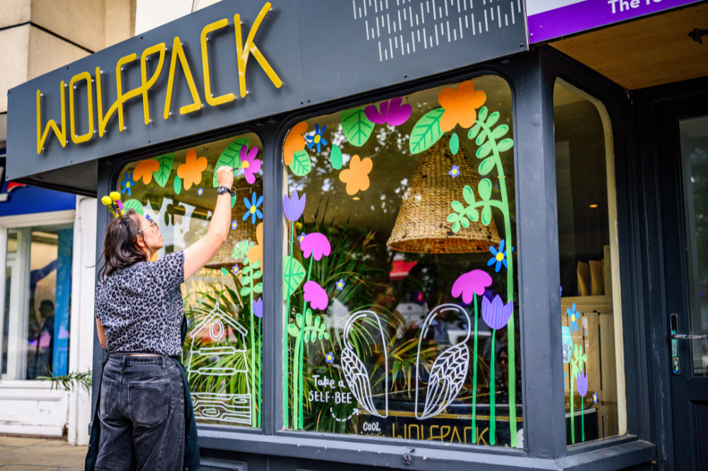 Annalees live window painting at WolfPack cafe