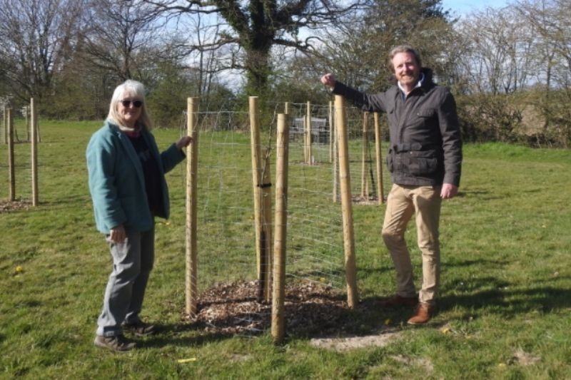 Two members of Glebe Field Thakeham stand with their new tree planting scheme