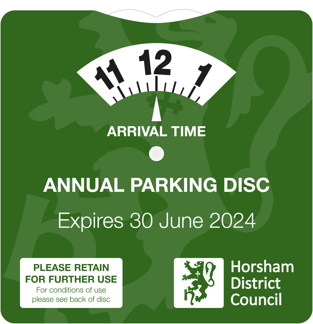 The Annual Parking Disc is a green cardboard clock with the Horsham District Council logo on it