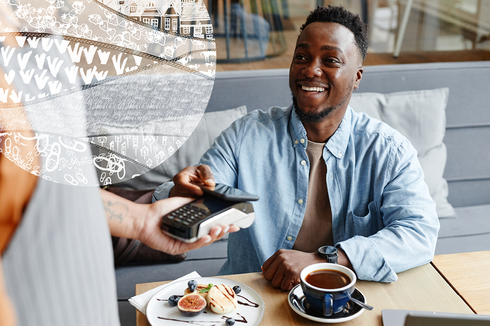 Man paying for coffee in a shop