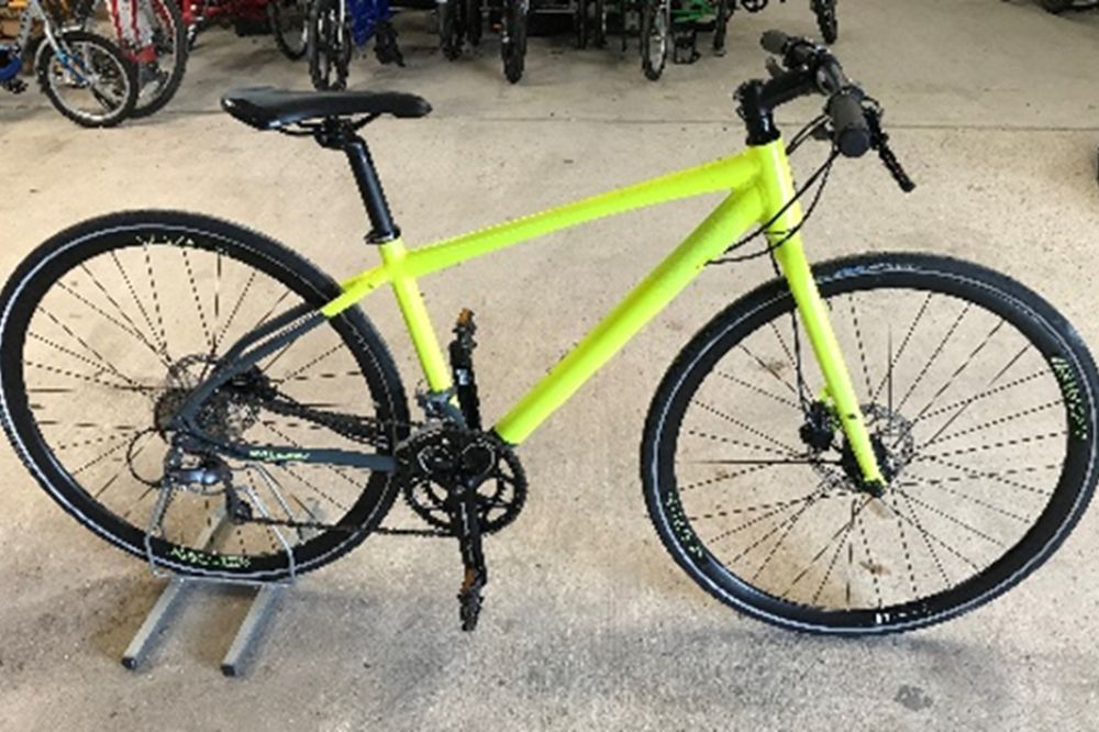 A Raleigh Strada bike in neon yellow