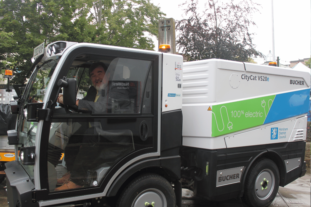Horsham District Council Cabinet Member for Environmental Health , Recycling and Waste Cllr Jay Mercer in one of the new all-electric street sweepers