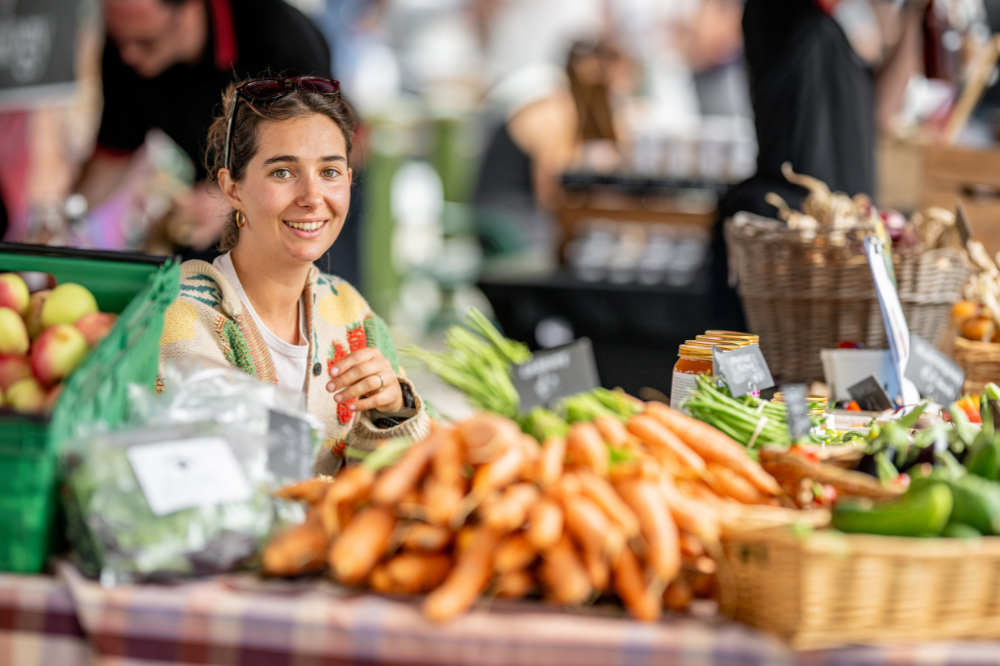 Market trader smiling at camera