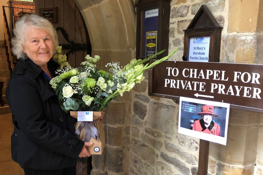 •	HDC Chairman Cllr Kate Rowbottom lays flowers on behalf of the people of Horsham District at St Mary's Church Horsham