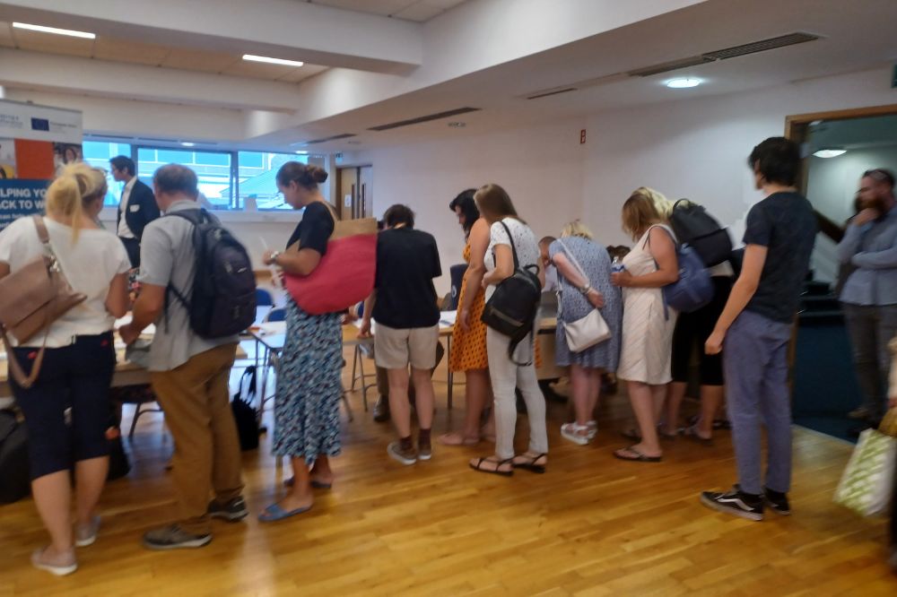 People at an event looking at tables