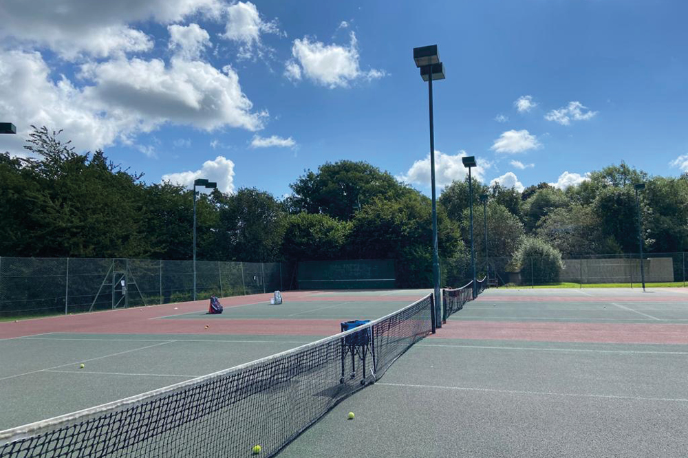 Horsham Tennis Club's new LED floodlights photographed on a glorious summer's day