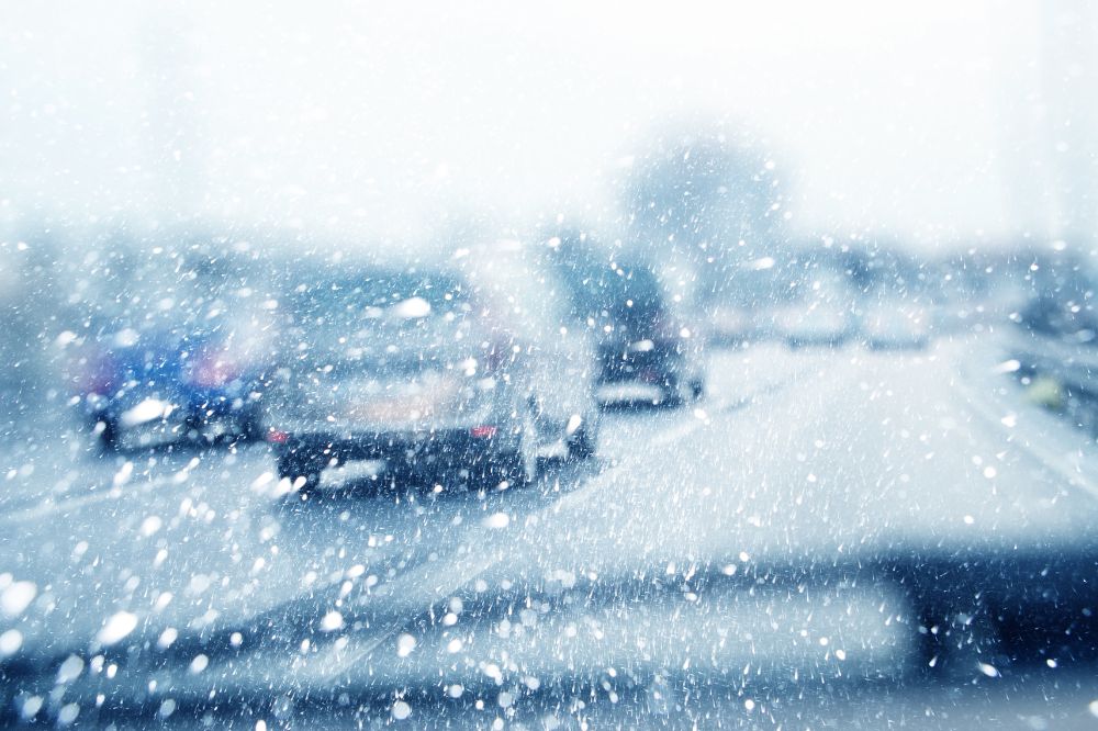 Car driving in heavy snow