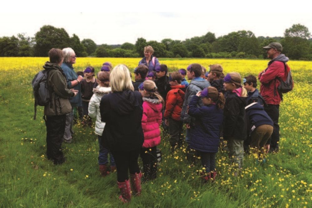 A group listening to the Horsham Field Studies teacher