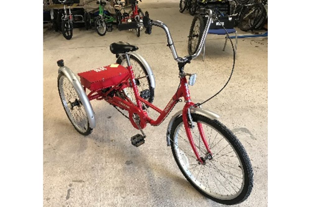 The red Brosker trike is powered for assisted pedalling