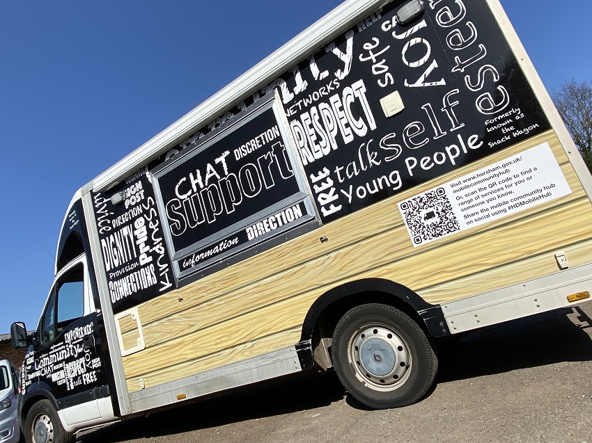 The Mobile Community Hub is decorated in black and white with inspiring words on it