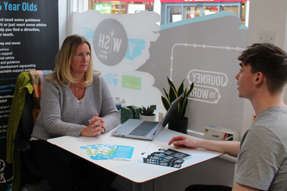 Y-WISH Support Officer talking with studen