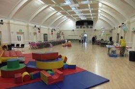 The Main Hall set up for a children's birthday party, with soft play equipment