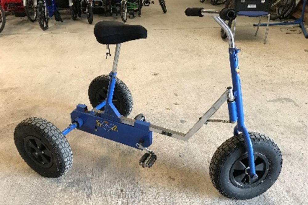 A blue fixed gear trike with adjustable height saddle