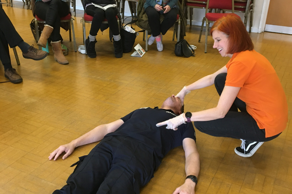 Image of someone doing first aid