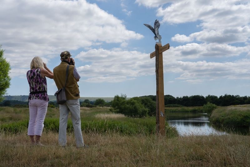 Two walkers look out over Pulborough Brooks, part of the Wildart Trail