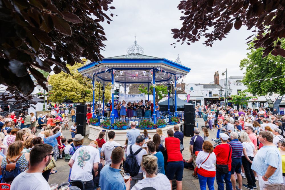 The Carfax bandstand during the Jubilee event. There are crowds watching the enterainment