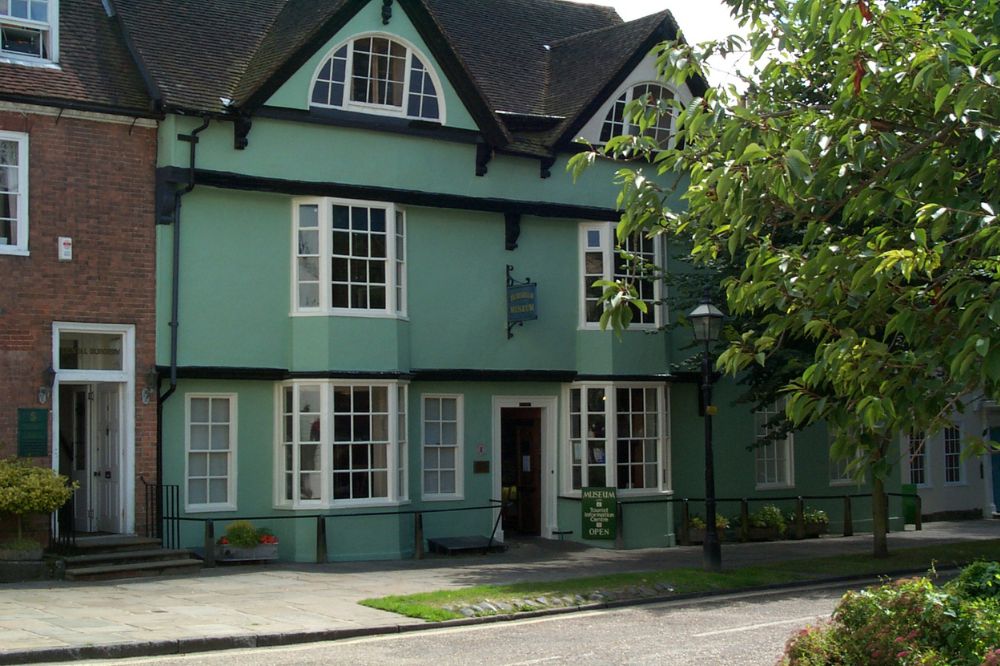 The exterior of Horsham Museum. The building is a pale green and hundreds of years old