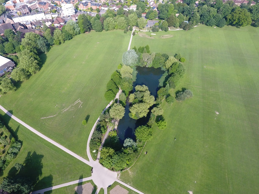 An overhead shot of Horsham Park pond at its lowest height