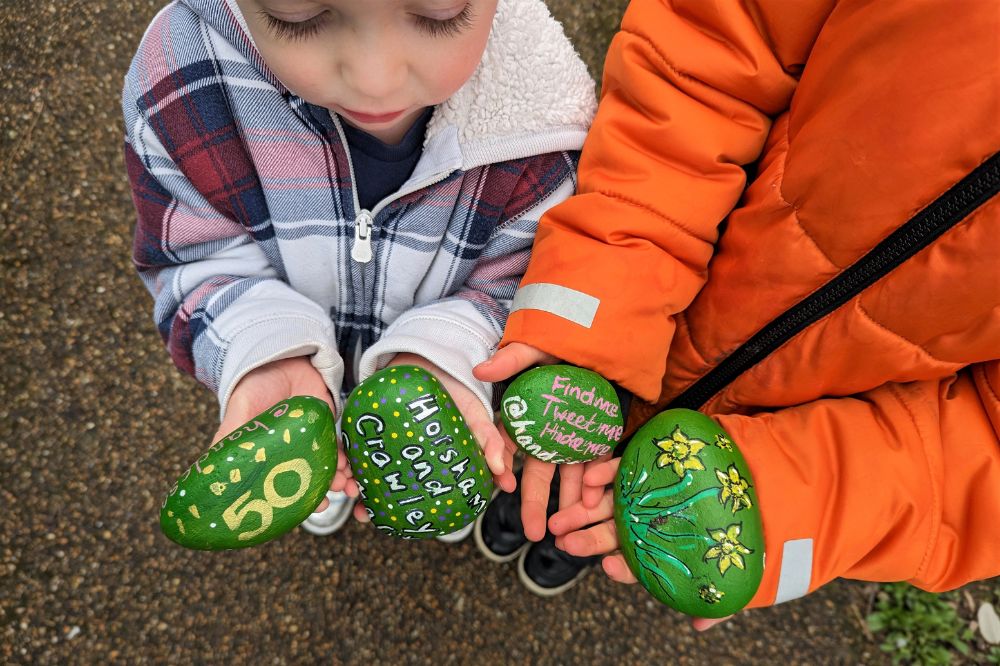 Children hold painted Samaritans rocks