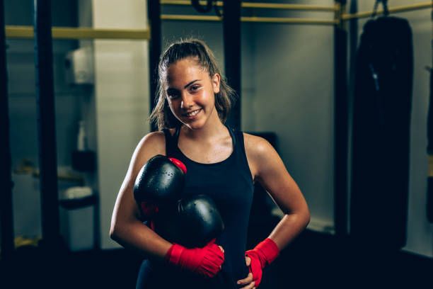 Female boxer smiling at camera