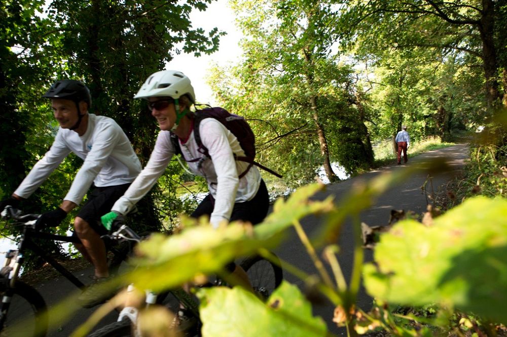 Cyclists on the Downs link wearing helmets and sunglasses