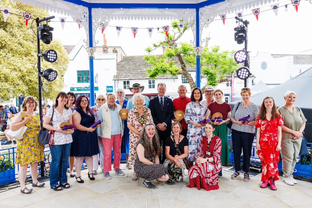 Volunteers and our VSS team on Horsham bandstand smiling